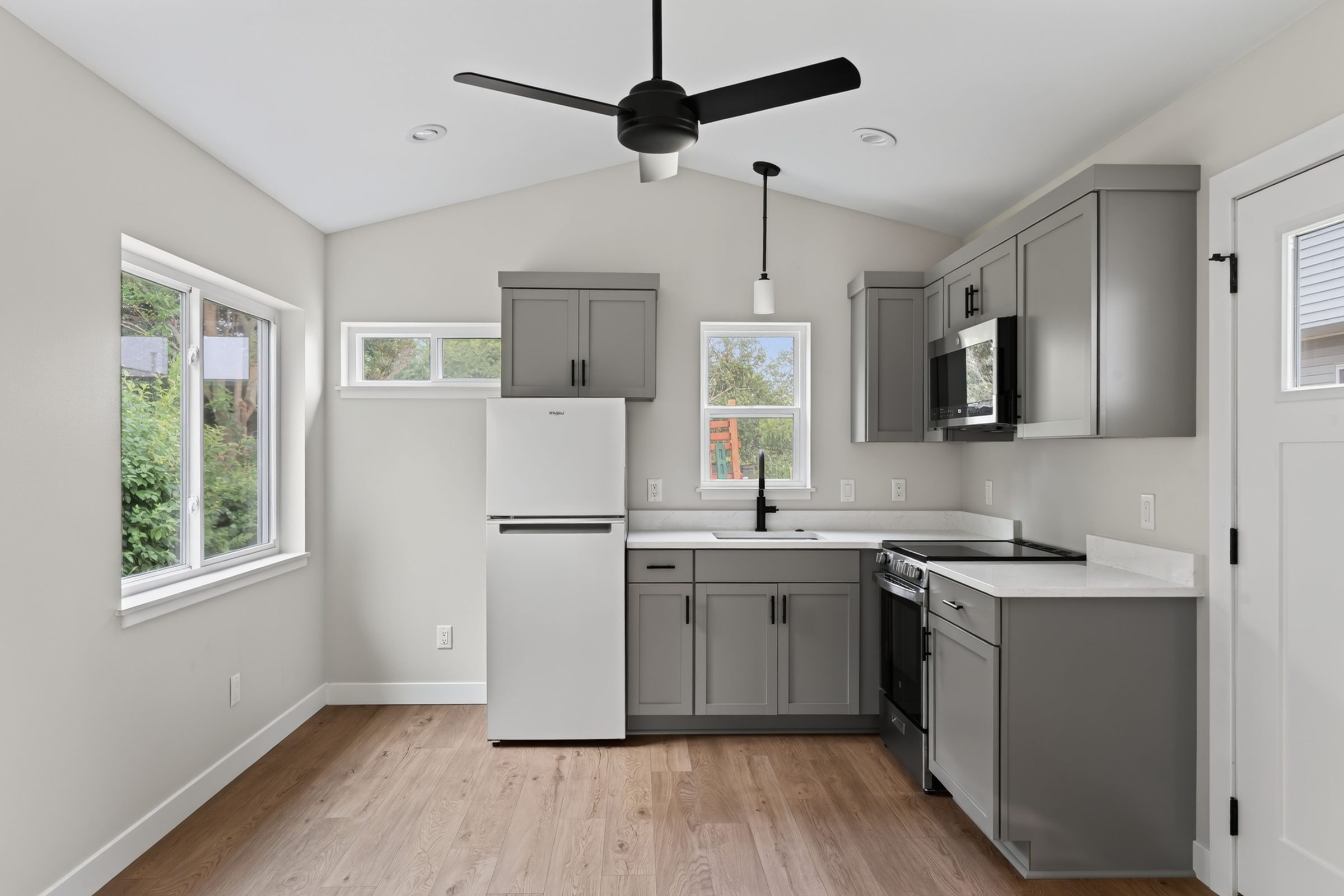 Kitchen and living area with sliding windows on two walls — aging-in-place ADU, Madison WI