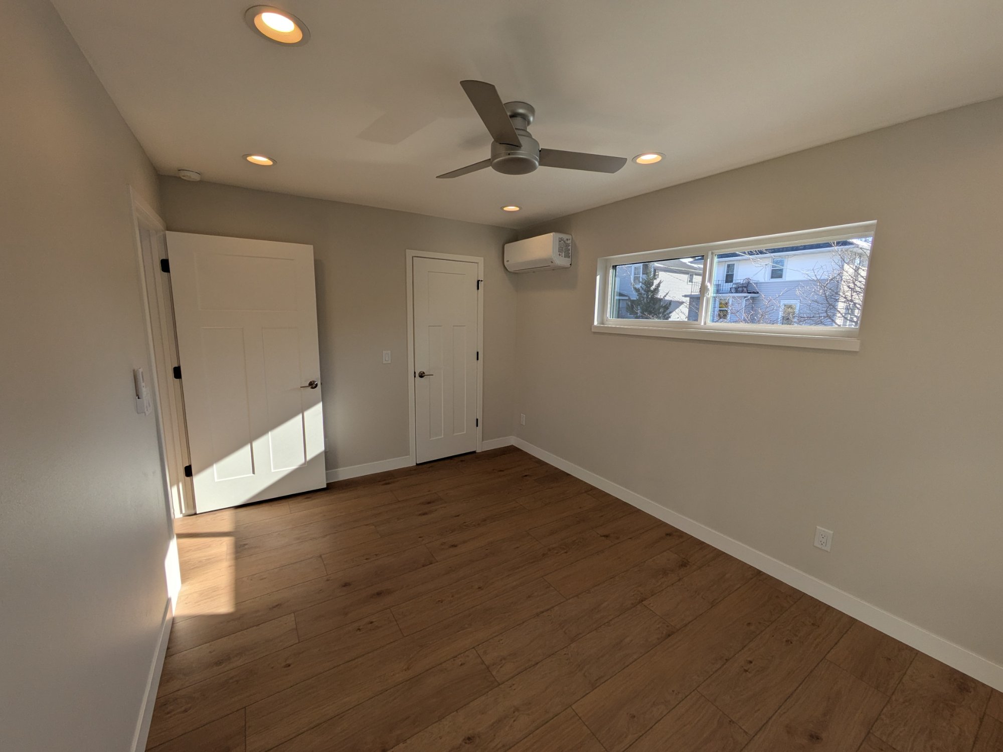Finished ADU bedroom with ceiling fan, mini-split HVAC and closet — Madison WI