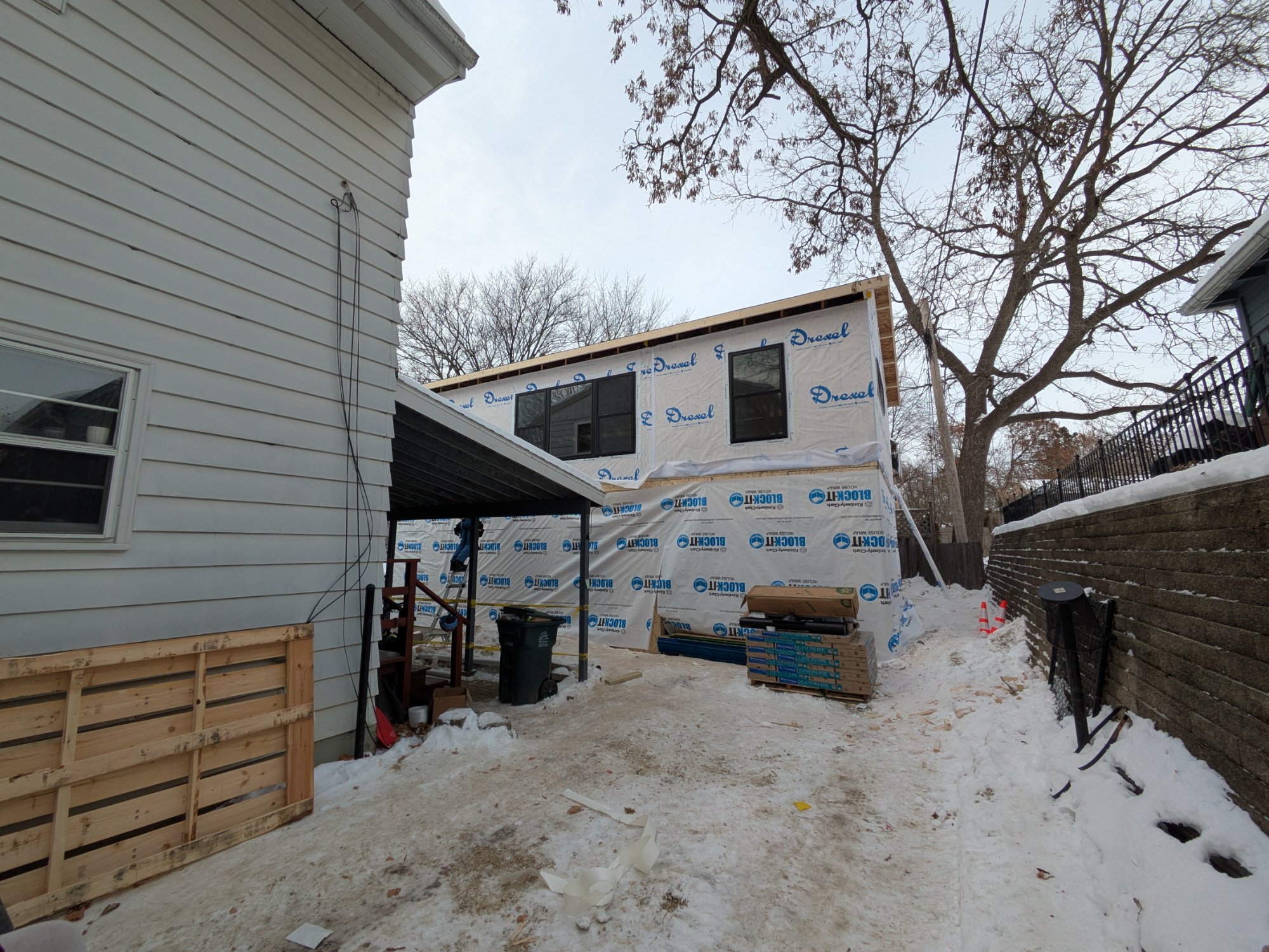 Two-story garage ADU building wrapped with housewrap — exterior view, Madison WI