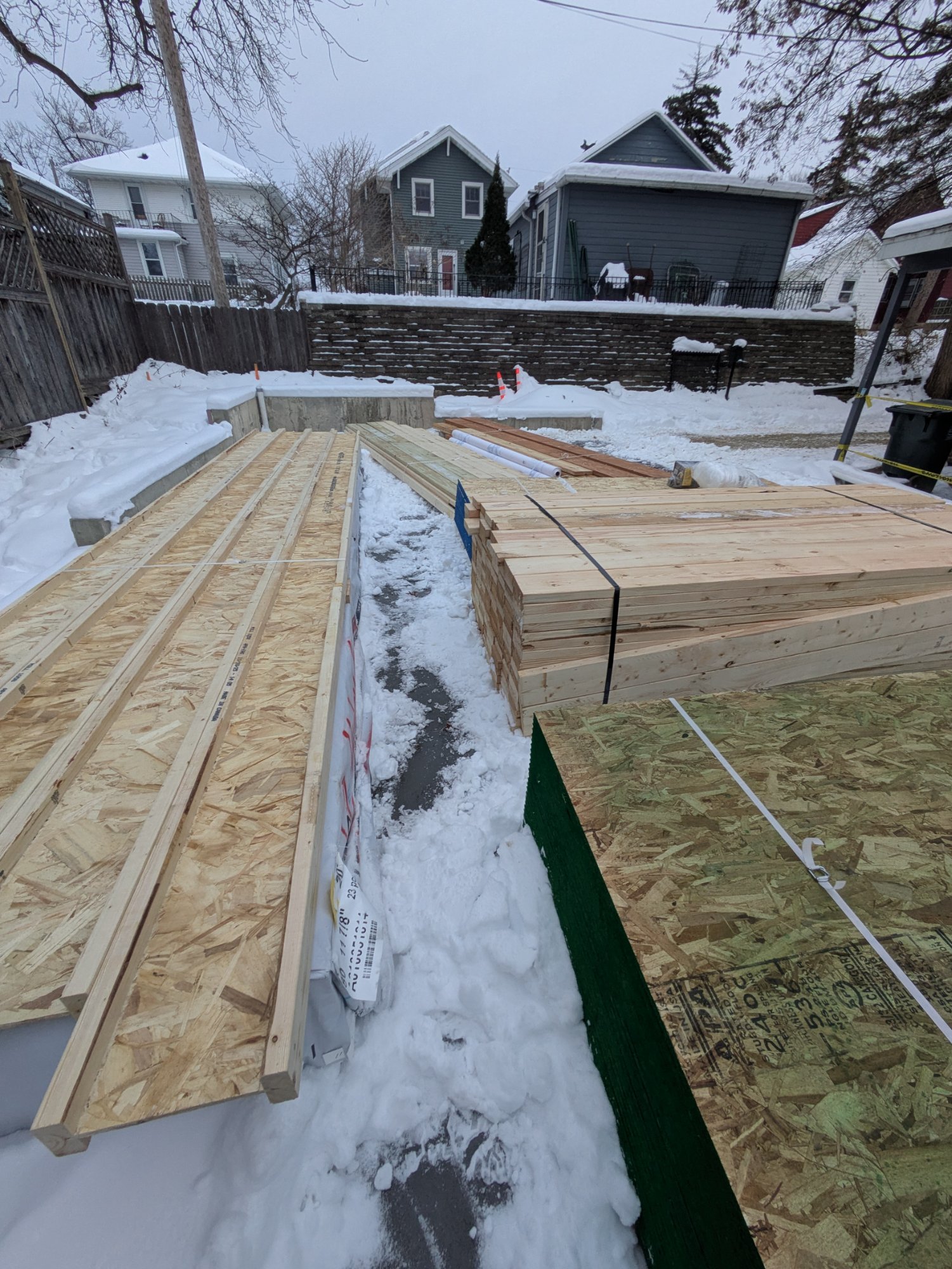 Exterior wood framing in winter — two-story garage ADU, Madison Wisconsin