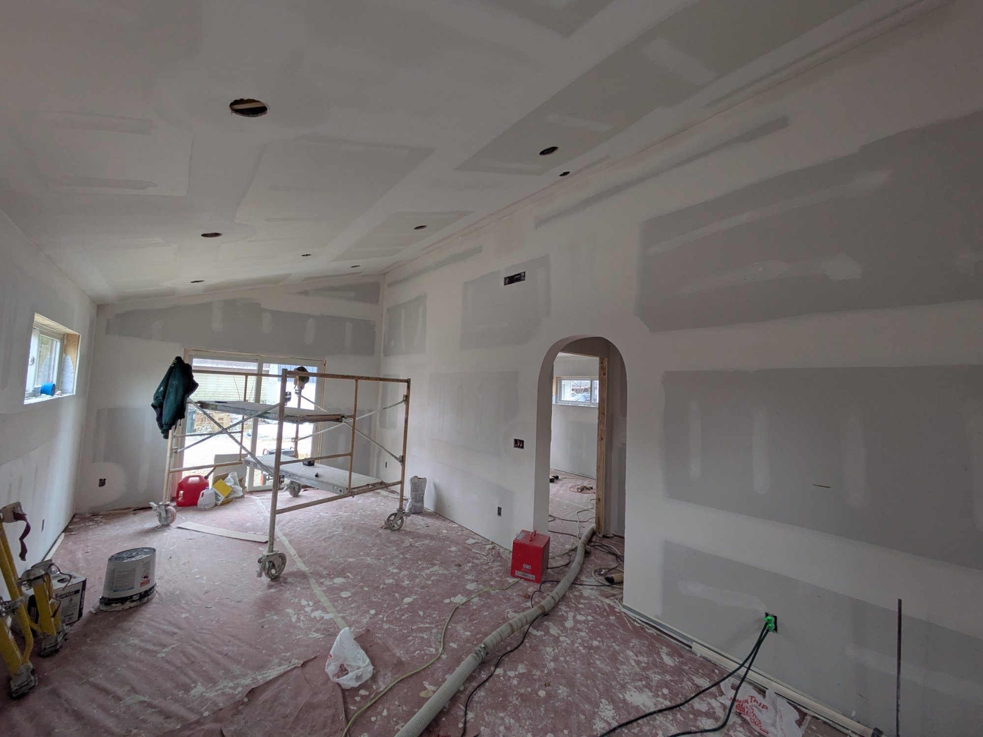 Drywall stage — living area with archway formed and vaulted ceiling — North Side ADU Madison WI