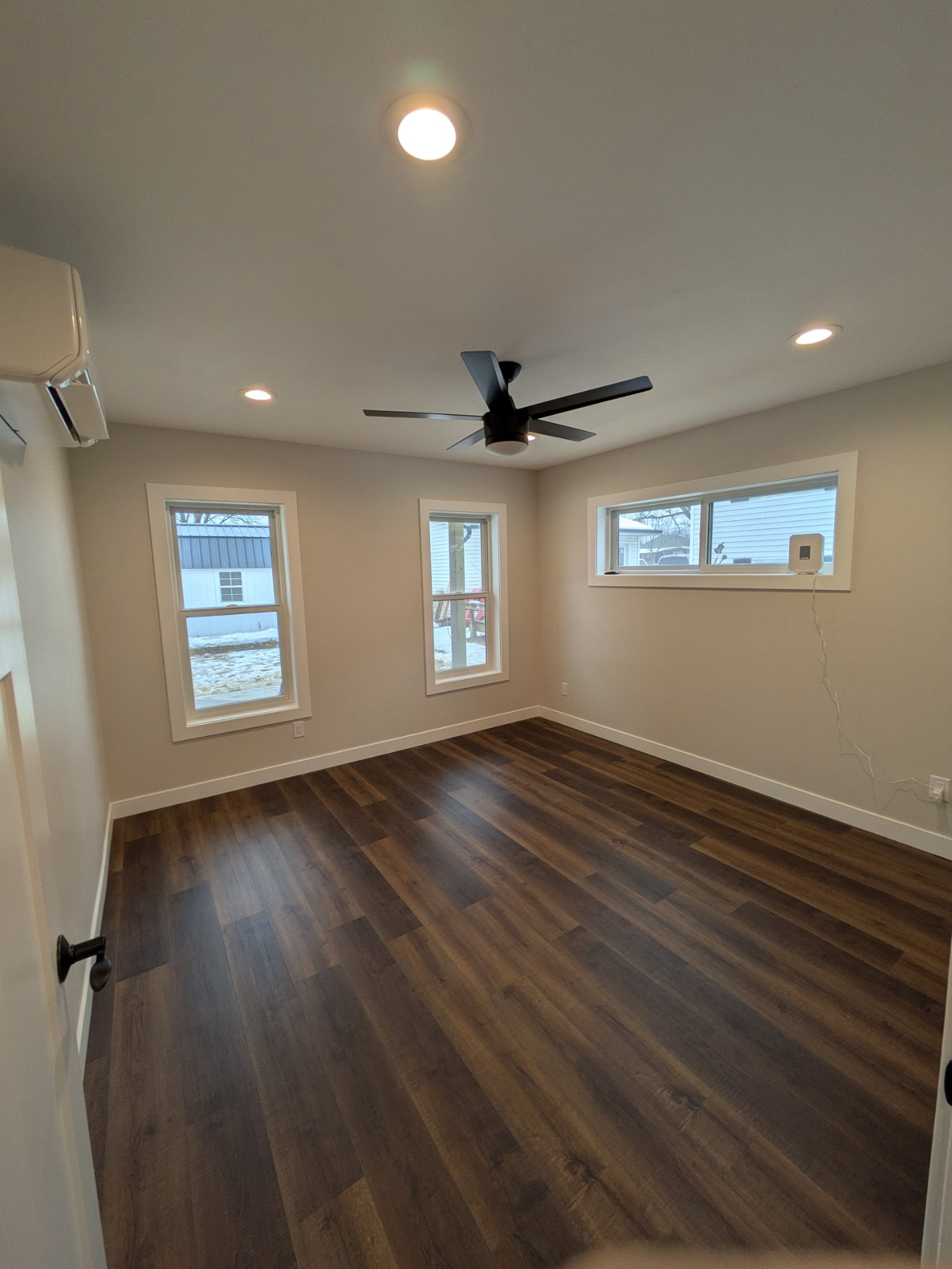Secondary room with multiple windows and mini-split — North Side ADU Madison WI